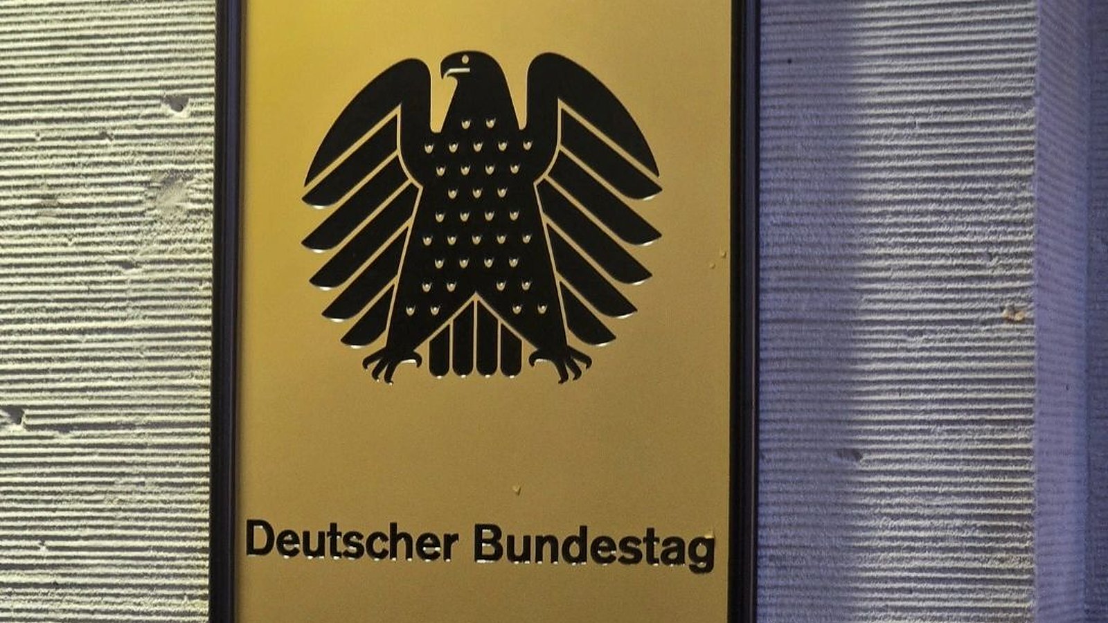 Sign with the federal eagle at the entrance of the German Bundestag